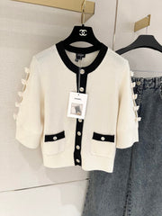 Bow-tie openwork cashmere cardigan with short sleeves