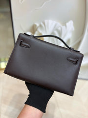 brown pochette with gold hardware