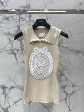 Open-knit vest with a Peter Pan collar