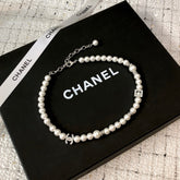CHANEL 26S DOUBLE C LOGO PEARL NECKLACE WITH CRYSTAL DETAIL IN SILVER METAL 631884