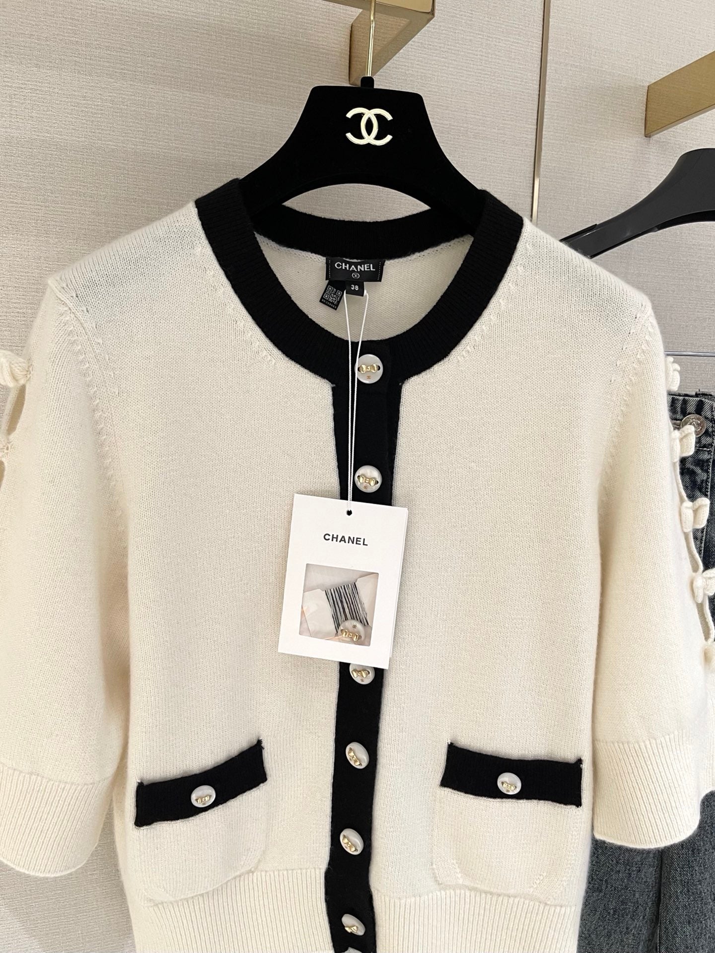 Bow-tie openwork cashmere cardigan with short sleeves