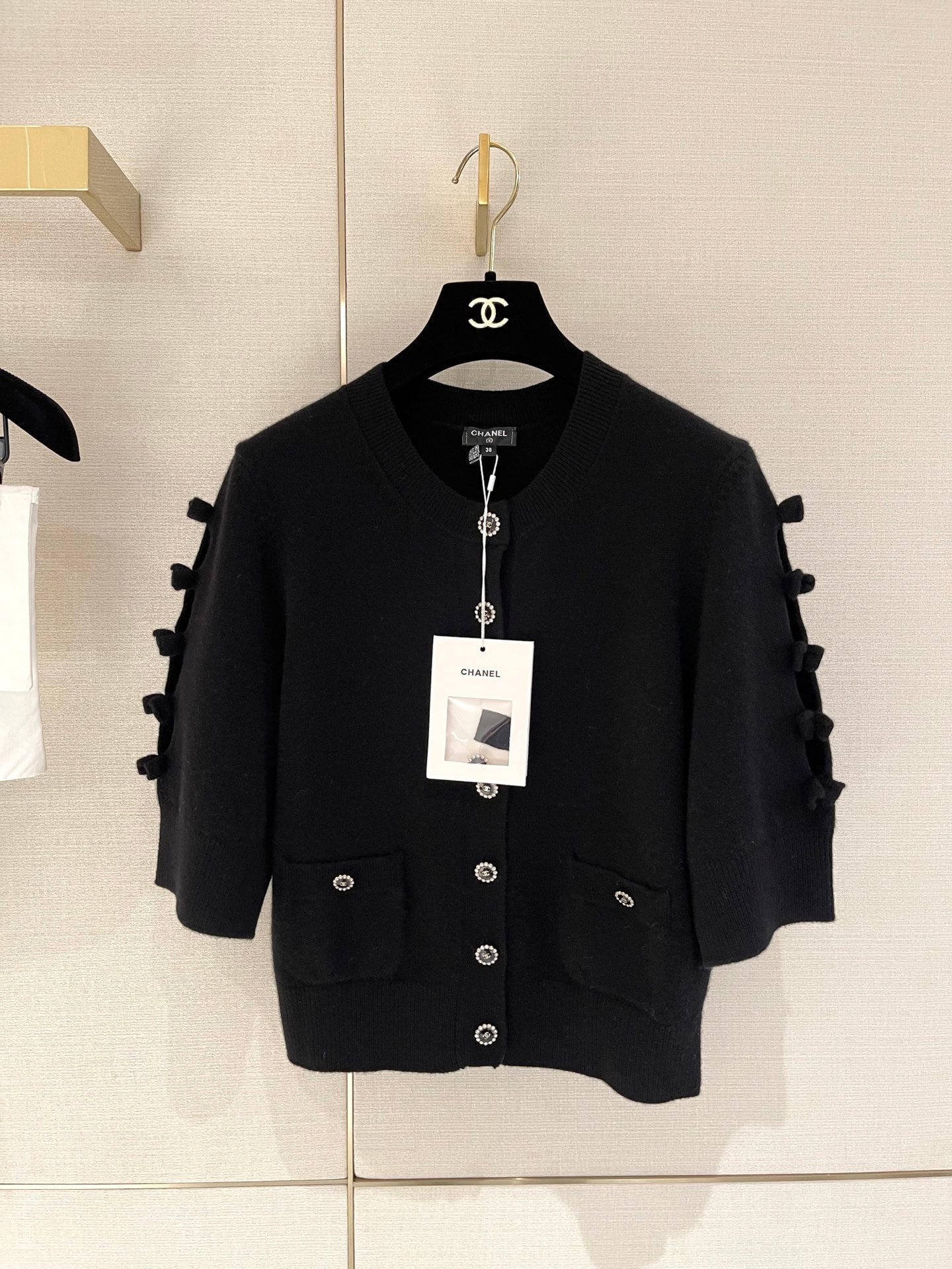 Bow-tie openwork cashmere cardigan with short sleeves