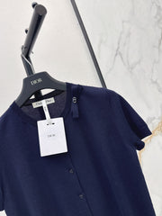 Short-sleeved knit top with a bow-accented round neck