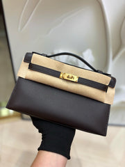 brown pochette with gold hardware