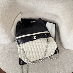 CHANEL 26S DRAWSTRING BACKPACK 44 IN BLACK AND WHITE NYLON GOLD HARDWARE